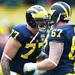 Michigan offensive linesman Taylor Lewan shouts at offensive lineman Kyle Kalis during spring practice at Michigan Stadium on Saturday, April 13, 2013. Melanie Maxwell I AnnArbor.com